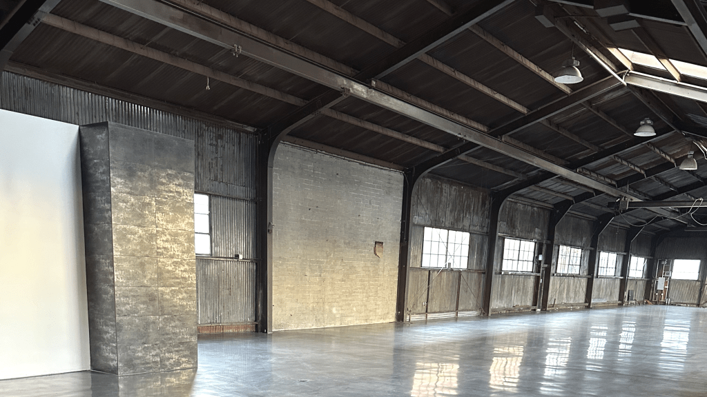 The highly polished concrete floors exude a sleek and modern aesthetic atmosphere.